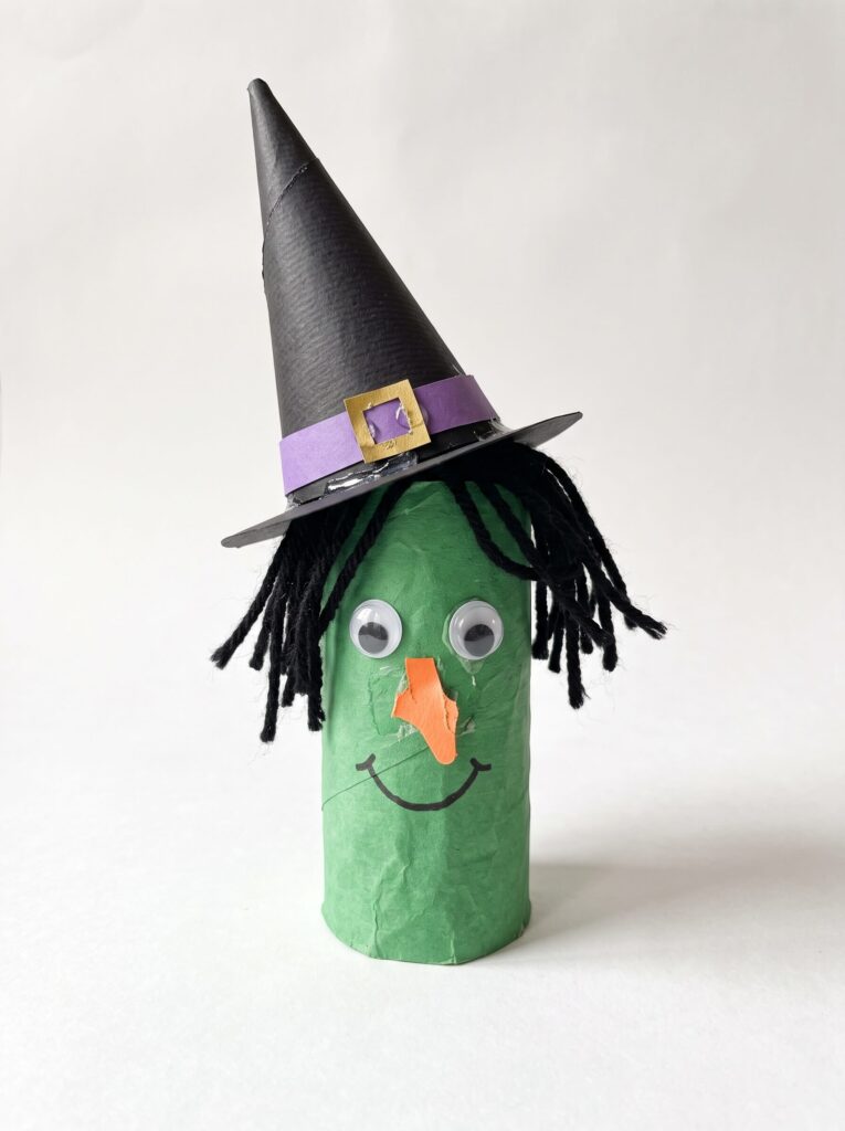 Green Faced Witch With A Tall Hat